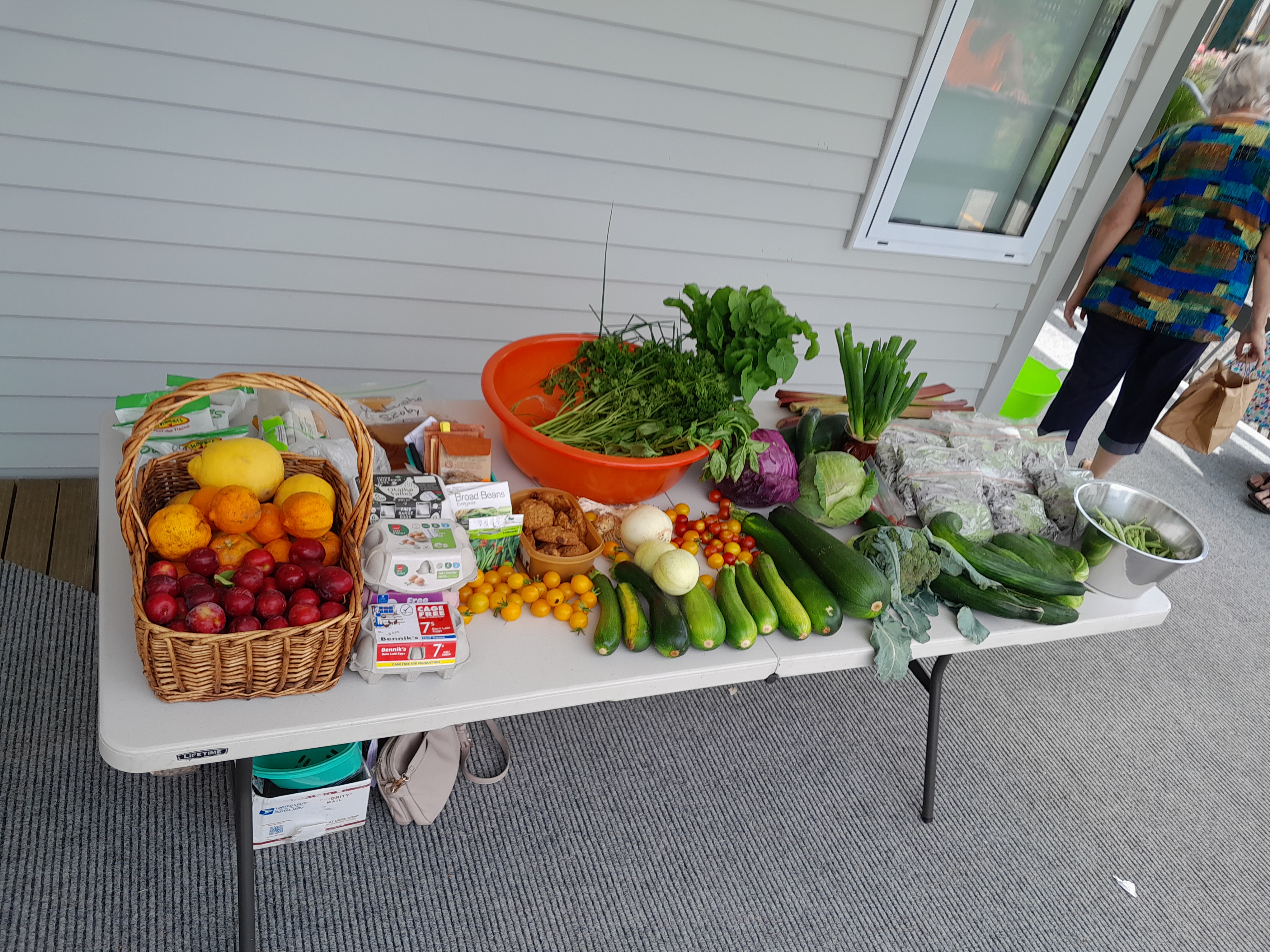 Table overflowing with produce.